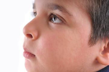 Close up image of a little boy’s face suffering urticaria.