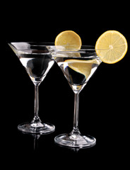 Martini glasses on black background