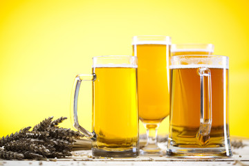 Beer glass with yellow background