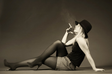 Beautiful blonde girl smoking