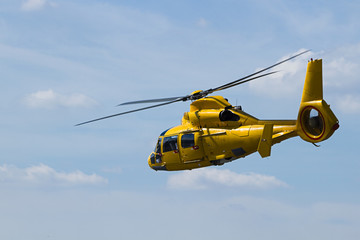 Yellow Helicopter flying