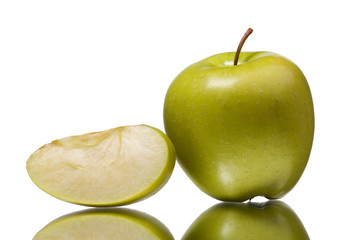 The green apple with the cut off segment