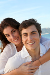 Portrait of lovely couple at the beach in summer