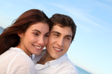 Portrait of lovely couple at the beach in summer