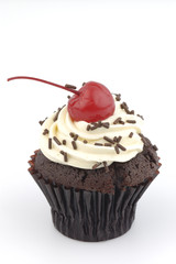 Cup cake and red cherry