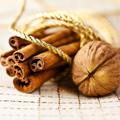Walnut and Cinnamon Sticks tied with a golden string