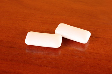 Chewing gums on brown