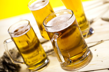 Beer glass with yellow background