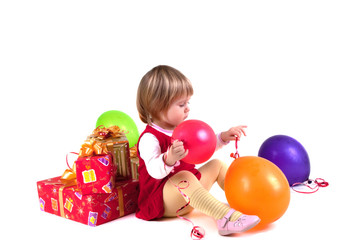 Fototapeta na wymiar Girl with balloons and presents