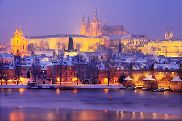 Fototapeta na wymiar Freezy foggy night snowy Prague with gothic Castle