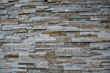 Wall of multicolored stacked stone