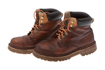 Alte Arbeitsschuhe vor weißen Hintergrund