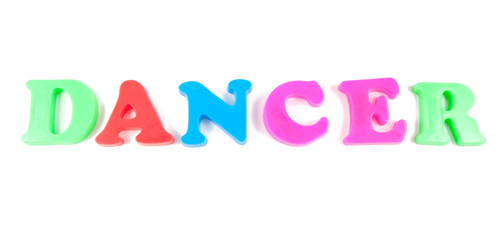dancer written in fridge magnets on white background