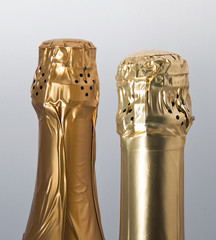 Fototapeta na wymiar Champagne bottles top