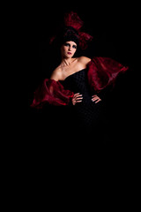 Femme fatale in a red-black dress