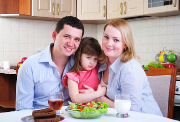 Dad, Mom and their little daughter