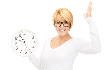woman holding big clock