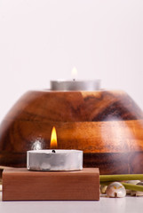 Candle with Flame on Wood Block