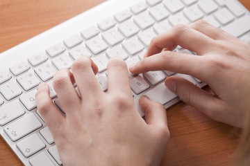 female hands on the keyboard