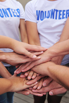volunteer group hands together