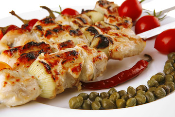 roast pork shish kebab on white