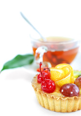 Cupcake with jelly and fruits over white