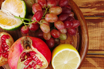 fruits on wooden plate