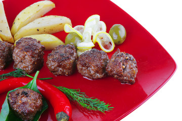 beef meatballs on red plate