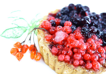 Cupcake with jelly and fruits over white