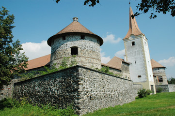 Fototapeta na wymiar Fortified church with defense wall. Racos, Transylvania, Romania