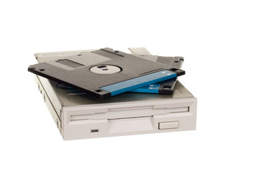 Floppy disk drive with diskettes isolated over white