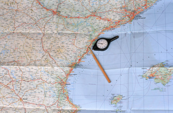 Map, pencil and curvimeter (map measurer)