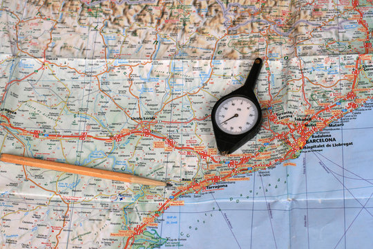 Map, pencil and curvimeter (map measurer)