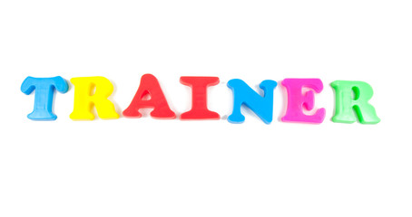 trainter written in fridge magnets on white background