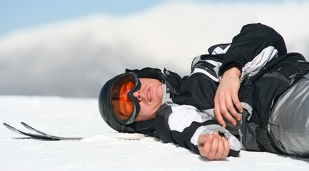 Skier relaxing on the top of the mountain