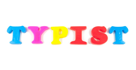typist written in fridge magnets on white background