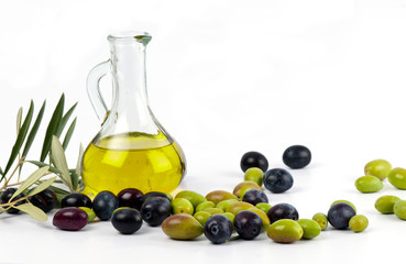 Extra virgin olive oil in a glass jar with freshly picked green