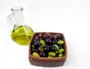 Extra virgin olive oil in a glass jar with freshly picked green