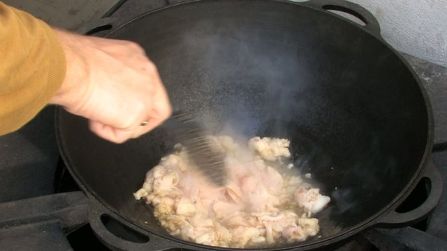 Melting Mutton fat in Cauldron