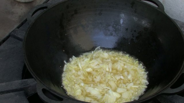 Steam from Frying onion in Wok
