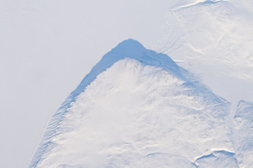 Fototapeta na wymiar Aerial View Snow and Ice Covered Cliff Baffin Island, Canada