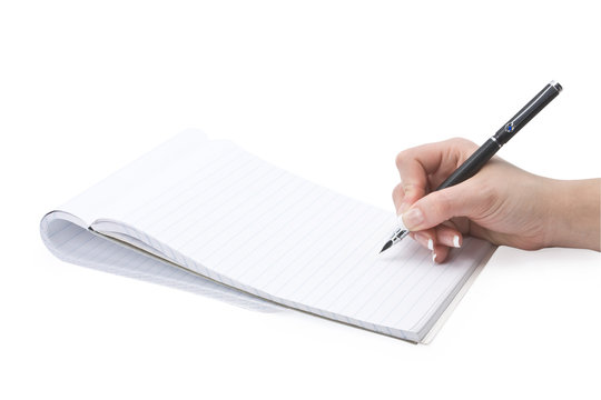 writing in a notebook hand