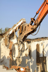 tractors are dismantling houses