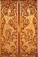 Fototapeta na wymiar Close golden carve door of church
