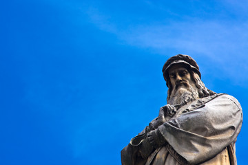 Da Vinci statue with blue sky