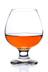 Snifter glass of cognac isolated on white