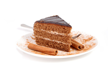 Slice of chocolate cream cake with cinnamon