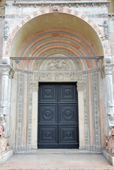 Fototapeta na wymiar Italy Ferrara St George’s cathedral main door