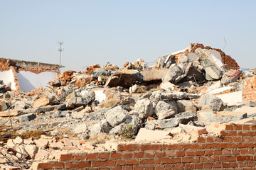 demolition of smoldering rubble