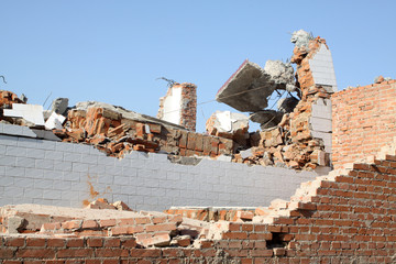 demolition of smoldering rubble